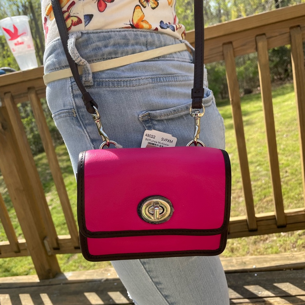 NWT COACH small pink/black trim crossbody bag.
